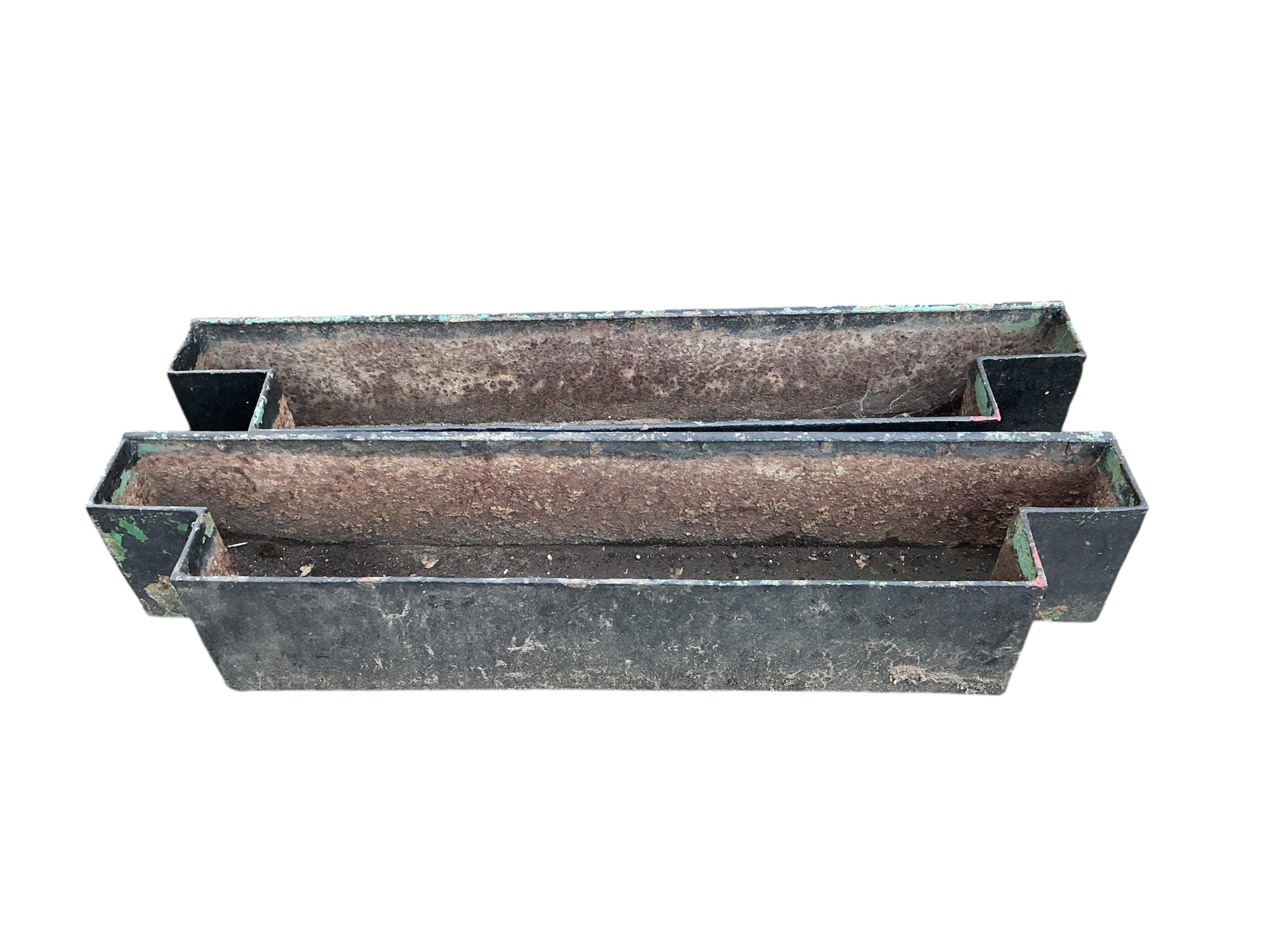 A pair of reconstituted stone models of eagles, height 34cm